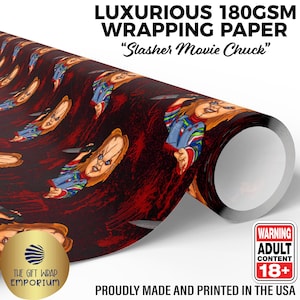 May include: A roll of 180GSM wrapping paper featuring a repeating pattern of the Slasher Movie Chuck character holding a knife against a dark red and black background. The text reads LUXURIOUS 180GSM WRAPPING PAPER Slasher Movie Chuck and WARNING ADULT CONTENT 18+.