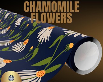 May include: A roll of premium gift wrap featuring a dark blue background with a repeating pattern of white chamomile flowers, green stems, and orange centers. Text reads PREMIUM GIFT WRAP, CHAMOMILE FLOWERS, 180GSM GLOSS PAPER, MADE AND PRINTED IN THE USA.
