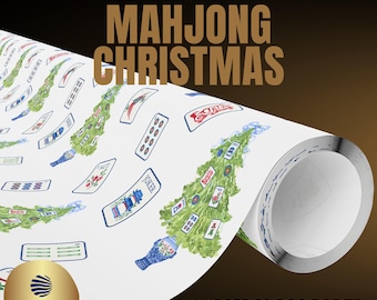 May include: A roll of white gift wrap paper featuring a repeating pattern of green Christmas trees decorated with various Mahjong tiles and blue and white porcelain vases. The text PREMIUM GIFT WRAP, MAHJONG CHRISTMAS, and 180GSM GLOSS PAPER are visible.