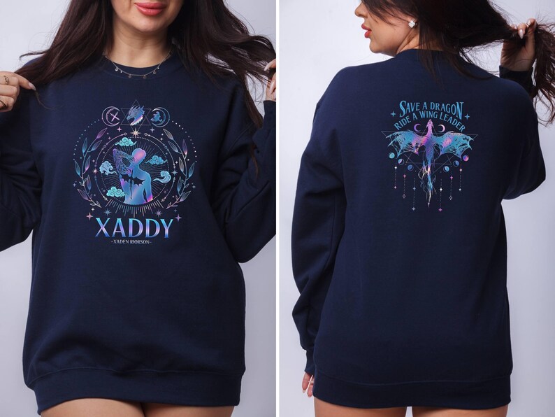 May include: A navy blue sweatshirt with a graphic design on the front and back. The front design features a person with wings and the text "XADDY - XADDY ROBINSON". The back design features a dragon with the text "SAVE A DRAGON - RIDE A WING LEADER".