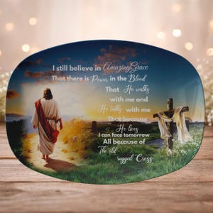 May include: A white ceramic mug with a black handle and the text "But First, Coffee" in a black, handwritten-style font. The mug is on a white surface.