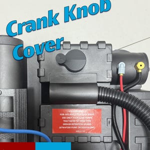 May include: A black Crank Knob Cover prop with a round knob and various tubes and wires. The text "Crank Knob Cover" is in blue. A red and white warning label is visible.