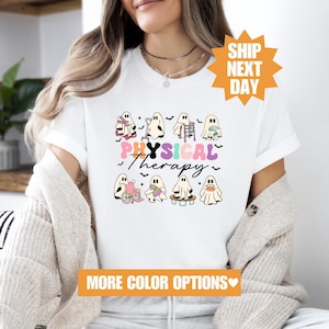May include: White t-shirt featuring a design of ghosts in various poses related to physiotherapy. The text "PHYSICAL Therapy" is written in colourful letters.