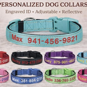 May include: A selection of personalised dog collars in various colours, including blue, red, black, purple, pink, and green. Each collar has embroidered text with a name and phone number. The collars are adjustable and reflective.