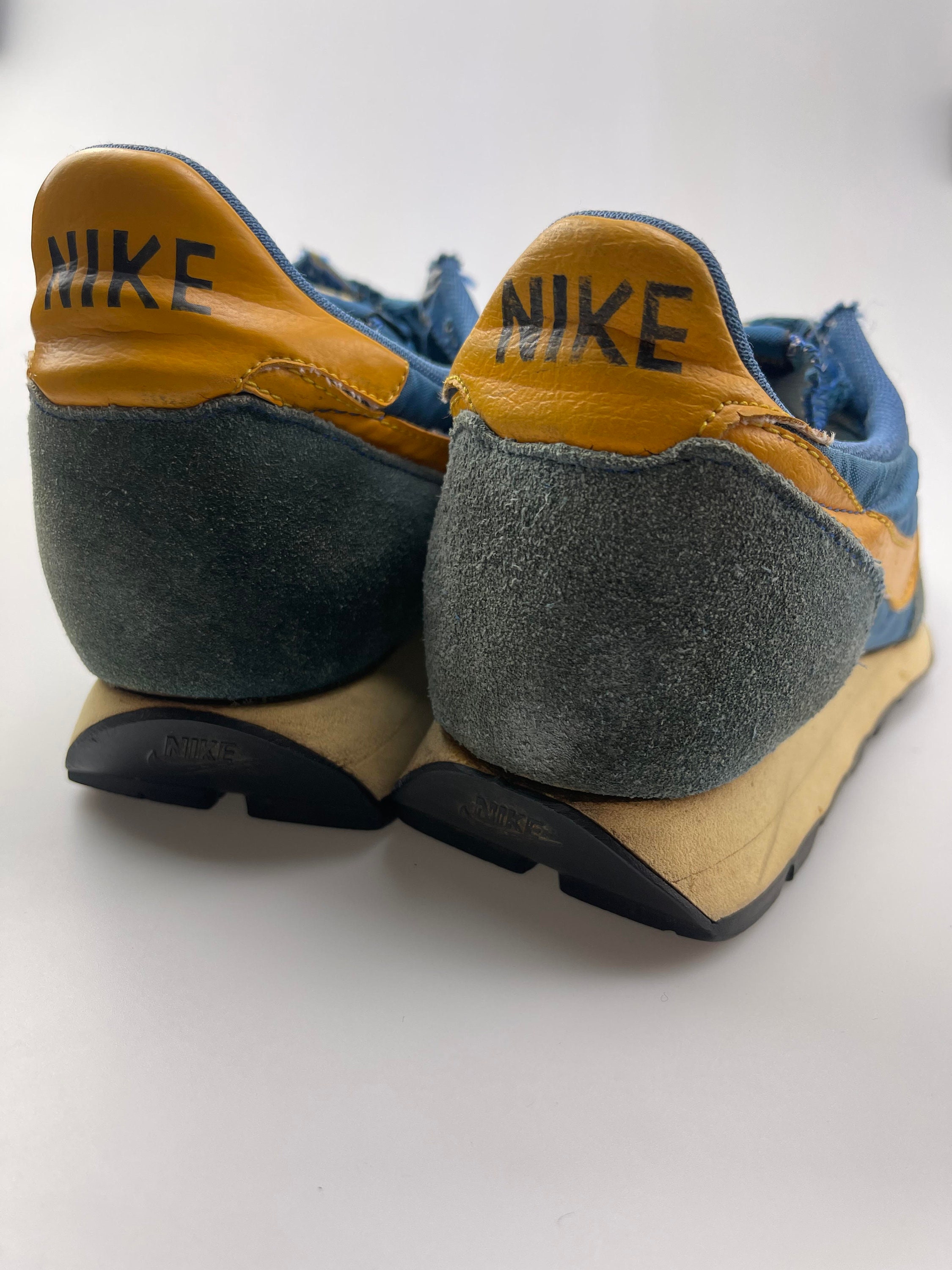 blue and yellow nike internationalist