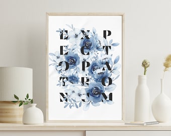 May include: A framed print with a white background and blue watercolor flowers. The flowers are arranged to spell out the words "Expect the Extraordinary".