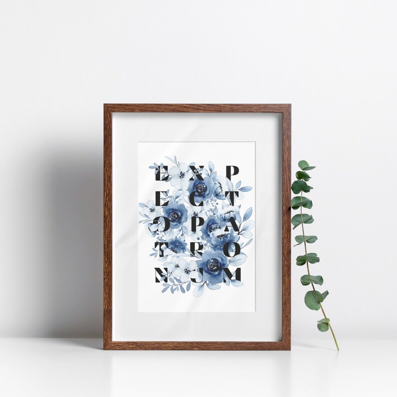 May include: A framed print with a white background and blue watercolor flowers. The flowers are arranged to spell out the word "EXPECTATION".