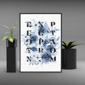May include: A framed print with a white background and blue watercolor flowers. The flowers are arranged to spell out the words "Expect the Unexpected".