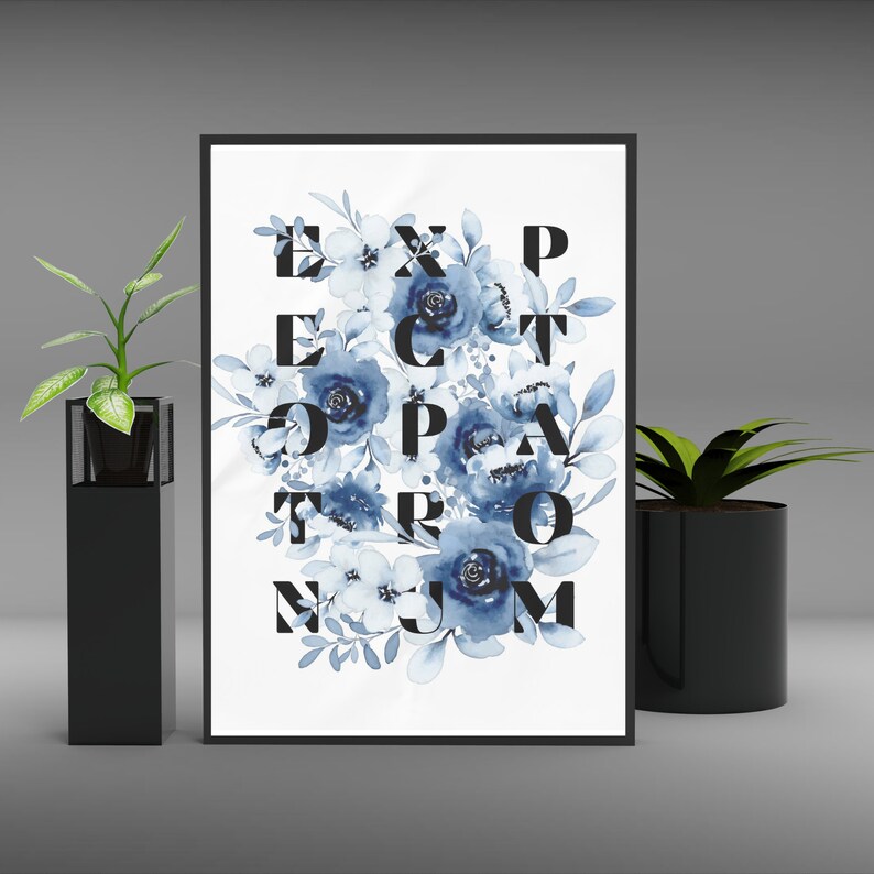 May include: A framed print with a white background and blue watercolor flowers. The flowers are arranged to spell out the words "Expect the Unexpected".