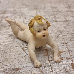 Beautifull Bisque Porcelain Piano baby figurine