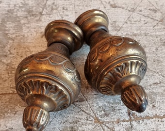 Set Of two French brass curtain pole ends with engraved pattern