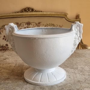 Impressive French Cast iron Planter dating XIX century in rare shape with flowers design on the sides