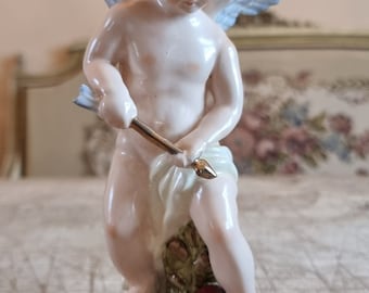 An enchanting late 18th century Meissen Porcelain figure of a 'Cupid'