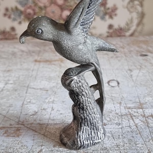 French Art Nouveau cast metal statue of a bird in flight, c 1900.