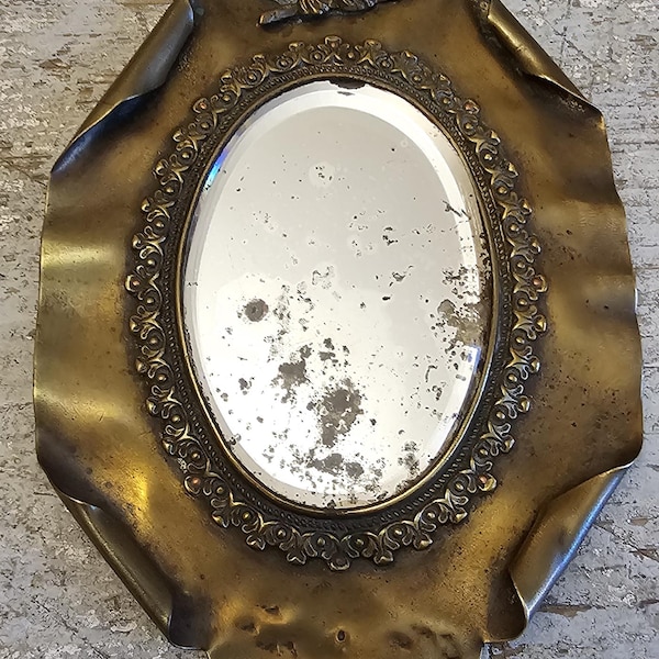 A sublime and rare Art Nouveau hand mirror with bird motive at the top