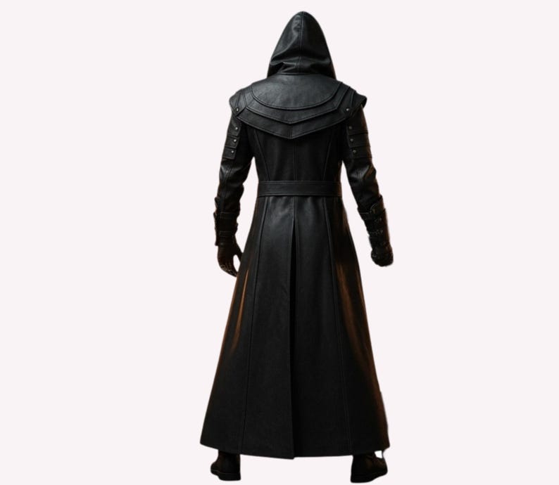 May include: A long, black leather coat with a hood, belt, and decorative shoulder accents. The coat has a full-length design and is shown from the back. The sleeves have decorative details near the wrists. The coat is made of a smooth, dark material.