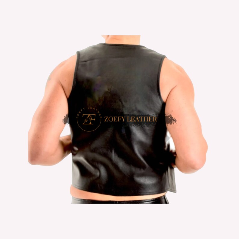May include: Black leather sleeveless vest with a gold logo that says "Zoefy Leather".