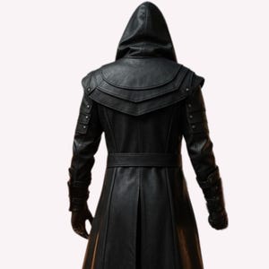 May include: A black leather hooded coat with a belt and decorative shoulder accents. The coat has a long, flowing design and is made of a textured material. The back view shows the intricate details of the garment.