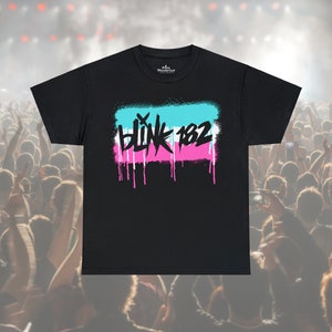 May include: Black t-shirt with a graphic of the band Blink 182 in a spray paint style with pink, blue, and white colors.