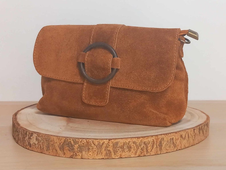 Leather, suede or suede bag, Cassiopeia in camel color and with matching strap. Matte steel metal finishes. image 1