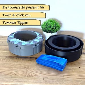 May include: A gray and blue replacement cassette for a Tommee Tippee Twist & Click diaper pail. The image also shows a black container, a blue refill, and a small potted plant. Text on the image reads "Ersatzkassette passend für", "Twist & Click von", and "Tommee Tippee".