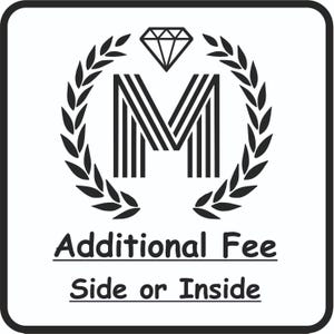 May include: Black and white logo with a stylized letter M surrounded by a laurel wreath and a diamond above. The text "Additional Fee Side or Inside" is below the logo.