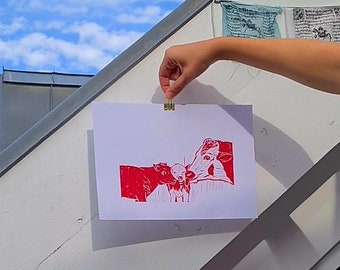 Red linocut with portrait of a cow