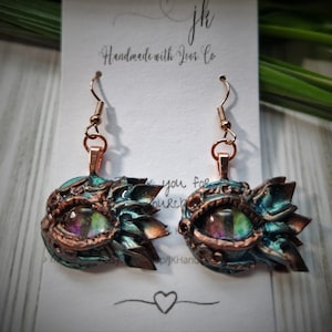 Polymer Clay Dragon&#39;s Eye Earrings. Hand sculpted with painted glass cabochon on a variety of earring findings.