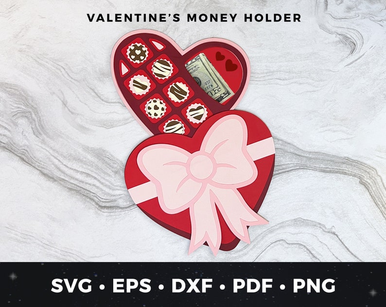 May include: A red heart-shaped box with a bow and a flap that opens to reveal a compartment for money. The box is decorated with chocolate candies and the words "Valentine's Money Holder".