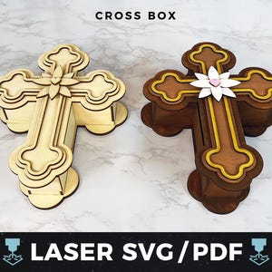 May include: Two wooden cross-shaped boxes. One is light-coloured with a floral accent, the other is dark brown with gold trim and a white flower. The text "CROSS BOX" and "LASER SVG/PDF" are visible.