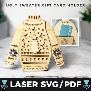 以下が含まれることがあります： レーザーカットされた木製のクリスマスセーターギフトカードホルダー。ホルダーの前面には、クリスマスツリー、雪片、星が描かれたお祝いのデザインが施されています。ホルダーの背面には、ギフトカード用のスロットがあります。カードスロットには「ギフトカード」の文字が印刷されています。ホルダーの下には「レーザーSVG/PDF」の文字が印刷されています。