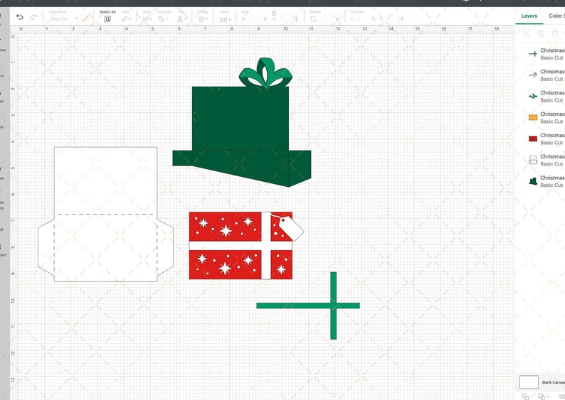 Puede incluir: Una plantilla imprimible para una caja de regalo de Navidad. La plantilla incluye una caja verde con un lazo, una caja roja con copos de nieve blancos y un sobre blanco con una l&iacute;nea discontinua para doblar.