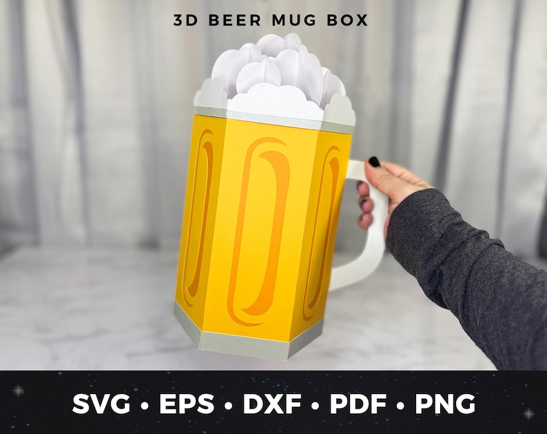 May include: A 3D beer mug box made of yellow and white paper. The box is shaped like a beer mug with a white handle and a foam-like top. The text "3D BEER MUG BOX" is at the top. The bottom of the image has the text "SVG &bull; EPS &bull; DXF &bull; PDF &bull; PNG".