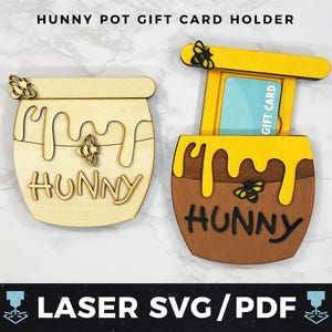 May include: Two wooden gift card holders shaped like honey pots. One is light-coloured with the word "HUNNY" and honey drips. The other is brown with yellow honey drips and a gift card inside. The text "HUNNY POT GIFT CARD HOLDER" is at the top.