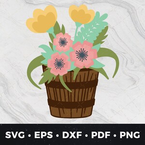 May include: A wooden flower pot with a brown and white striped pattern, filled with pink and yellow flowers. The flowers are arranged in a bouquet with green leaves.