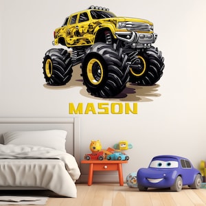 May include: A yellow monster truck with black tires and a black and yellow design. The truck has the name "MASON" written in yellow letters below it.