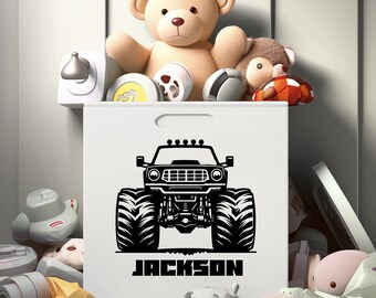 May include: White toy storage bin with a black monster truck graphic and the name "JACKSON" printed below. The bin is filled with stuffed animals and toys.