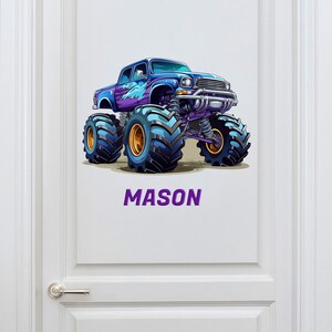 May include: A purple and blue monster truck with large tires and the name "MASON" printed below it.