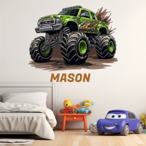 May include: Green monster truck with large tires and flames on the side, driving through mud. The truck has a name "MASON" written below it.