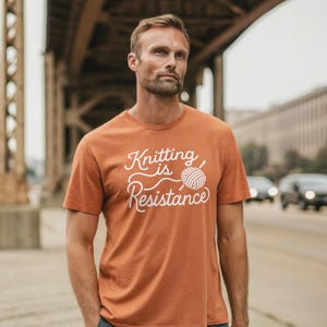 100% Cotton Knitting Is Resistance T-Shirt - Minimalist Yarn Graphic Protest-Inspired Tee | Artisan Screen Printed image 3