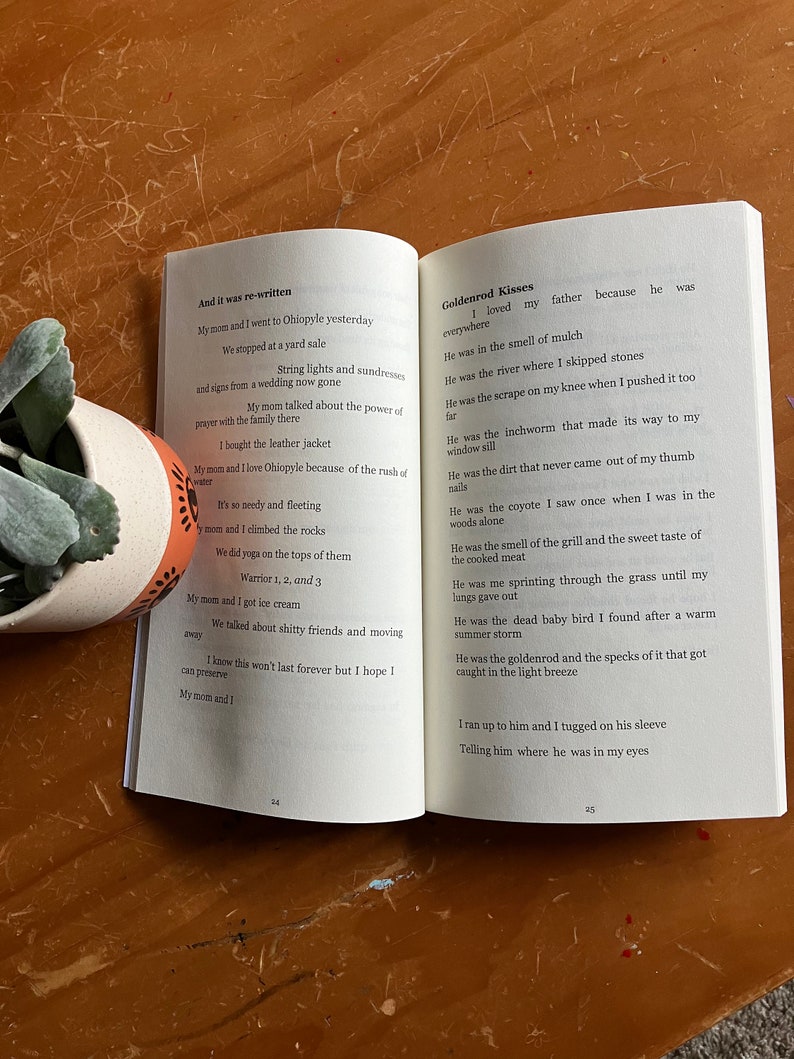May include: Open book with a poem about goldenrod kisses. The poem is written in a simple, conversational style and describes the beauty of goldenrod flowers. The book is open to page 24 and 25.