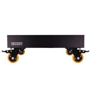 May include: A rectangular black platform with the white text Butcher Block Acoustics printed on the front. The platform is supported by four black swivel casters, each featuring a bright orange wheel and a locking lever mechanism for stability.