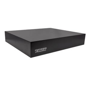 May include: A solid black rectangular platform with a smooth finish. The front edge features a white logo that reads Butcher Block Acoustics. The object has a thick, block-like construction with sharp, clean edges and a flat top surface.