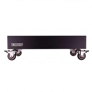 May include: A rectangular black platform stand featuring the white text Butcher Block Acoustics on the front left side. The stand is supported by four silver metal swivel casters with dark wheels, each equipped with a locking mechanism for stability.