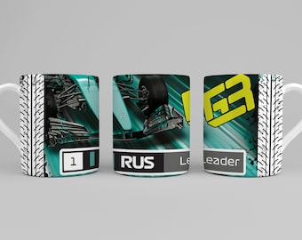 May include: White ceramic mug featuring a teal and black racing car design. The mug has a tire track pattern on the sides and the word "RUS" on the front. The mug also has the number "1" and the word "Leader".