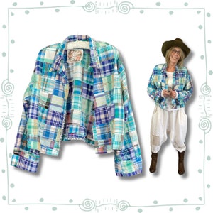 May include: A blue and green patchwork cropped jacket with a collar and long sleeves. The jacket is made of a variety of different plaid fabrics.