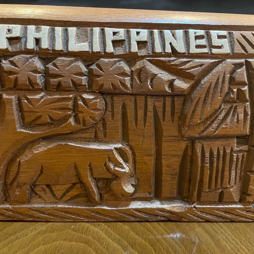 Carved Philippine Scrimshaw Water Buffalo horns with shops wood base.