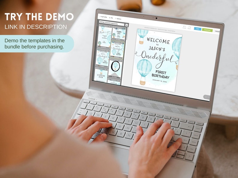 May include: A laptop screen displaying a digital design template for a first birthday party. The design features blue and white hot air balloons with the text "Welcome to Jason's Onederful First Birthday".