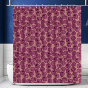 May include: A pink and white shower curtain with a repeating pattern of pink raspberries.