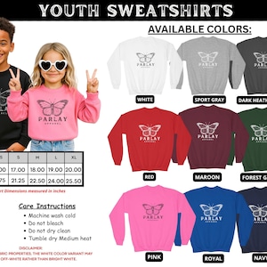 May include: Youth sweatshirts with a butterfly design are available in various colours. The image shows a black and pink sweatshirt with the word "PARLAY" and a butterfly graphic. Available colours include white, sport grey, dark heather grey, red, maroon, forest green, pink, royal, and navy.
